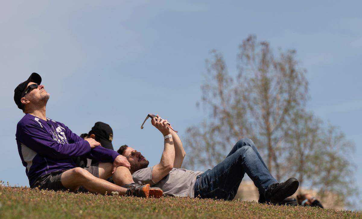 Several hundred people attended an eclipse party at Exploration Place on Monday.
