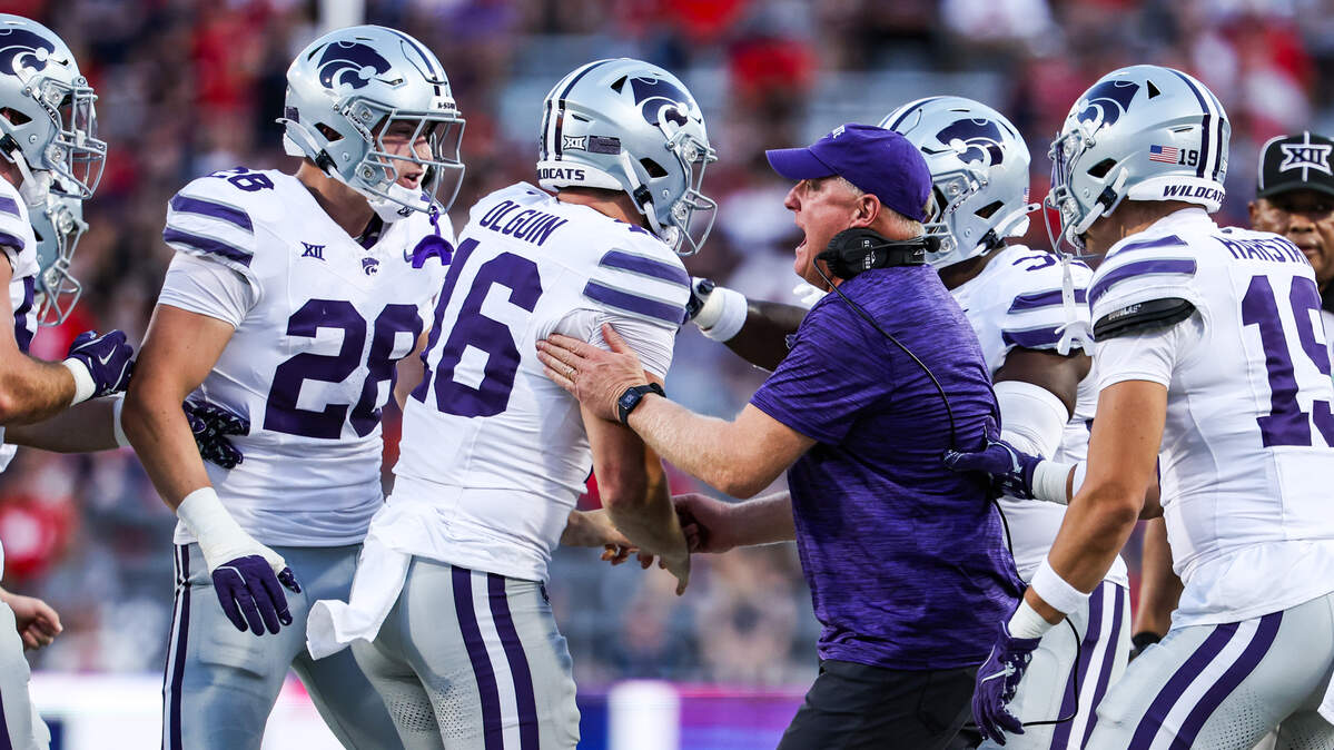 Sep 12, 2025; Tucson, Arizona, USA; Kansas State Wildcats head coach Chris Klieman celebrates with long snapper Mason Olguin (16) after they gain possession of the ball during the first quarter of the game against the Arizona Wildcats at Arizona Stadium. Mandatory Credit: Aryanna Frank-Imagn Images