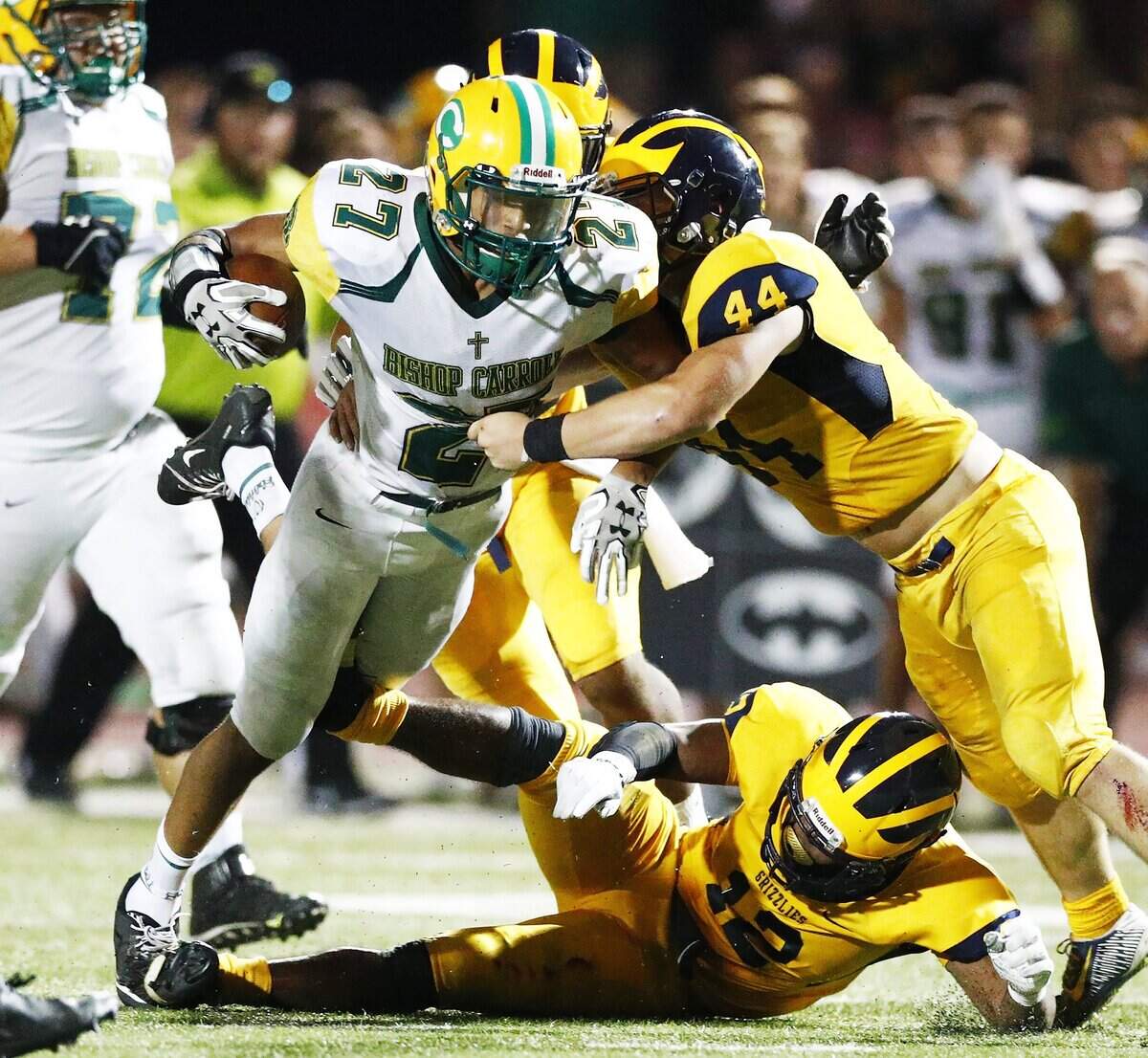 Northwest’s Josh Carter, right, stops Bishop Carroll’s Desmond Smith in the third quarter Thursday night at Northwest. 