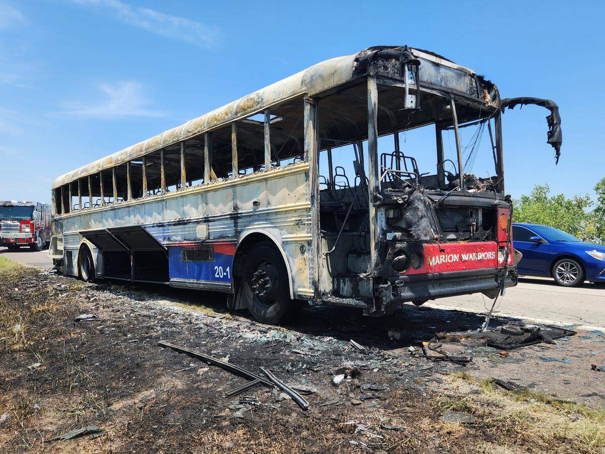 A USD 408 bus was destroyed in a fire Friday on I-135. The occupants, which included the high school football team, coaches and the bus driver, escaped unharmed.
