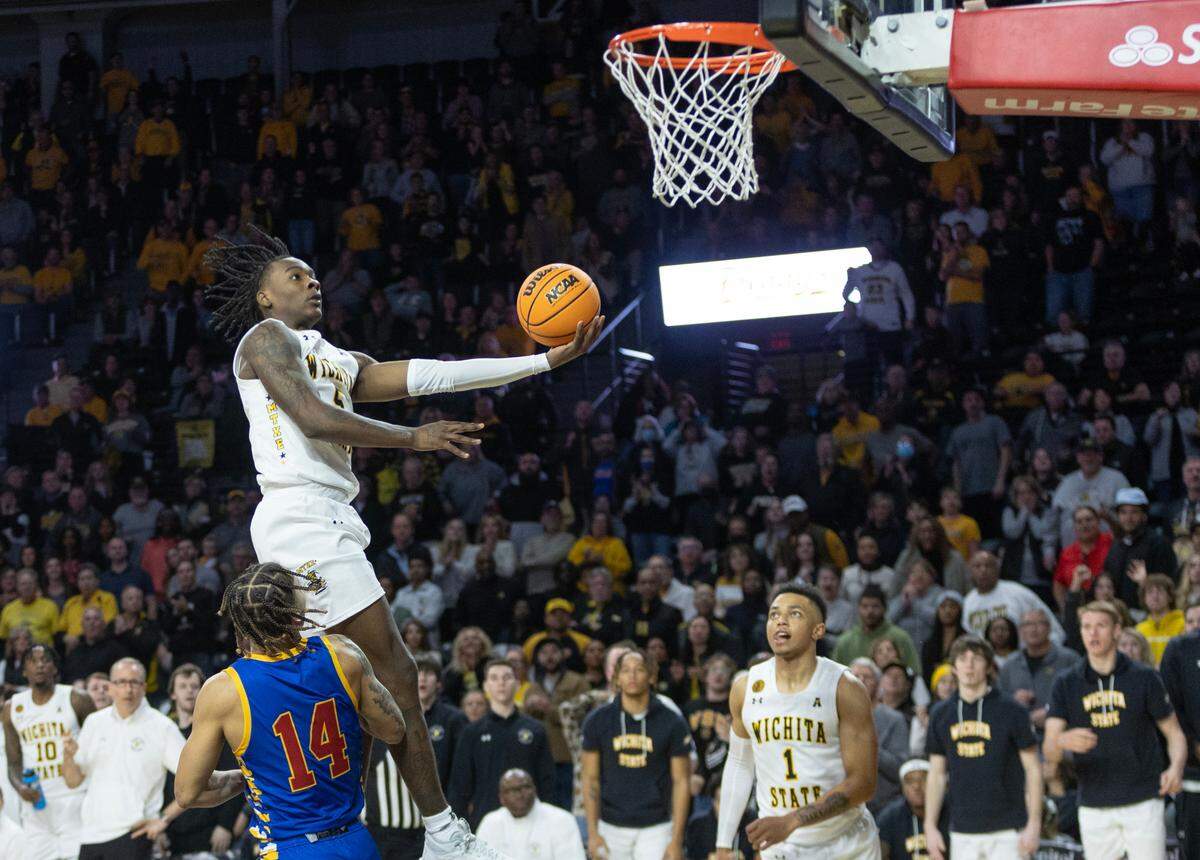 Wichita State’s Jaron Pierre Jr. scores the go-ahead basket late in the game against Tulsa on Saturday. The Shockers held on for a 73-69 win.