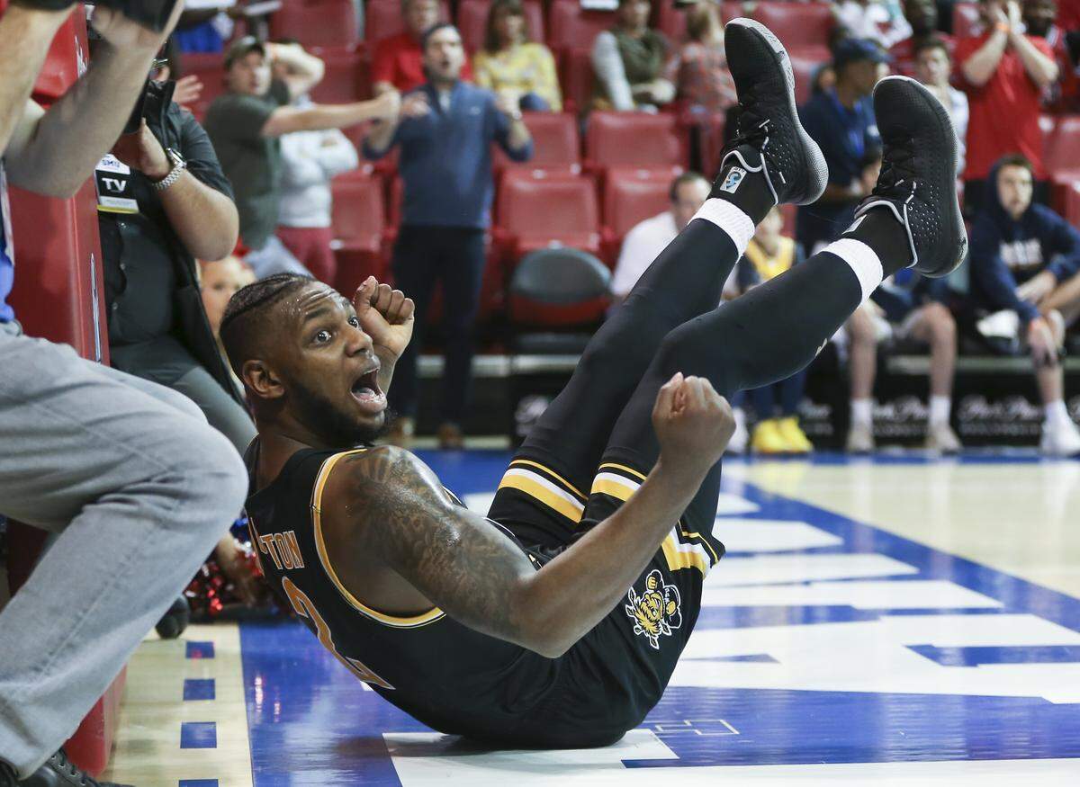 Wichita State’s Jamarius Burton pleads with the ref for a foul call during a dramatic comeback after being down 24 to SMU in the second half. Wichita State went on to win 66-62.