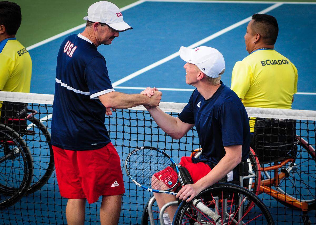 Wichita native Casey Ratzlaff celebrates with coach Jason Harnett after winning a match against Ecuador at the World Team Cup Americas Qualifications in February.