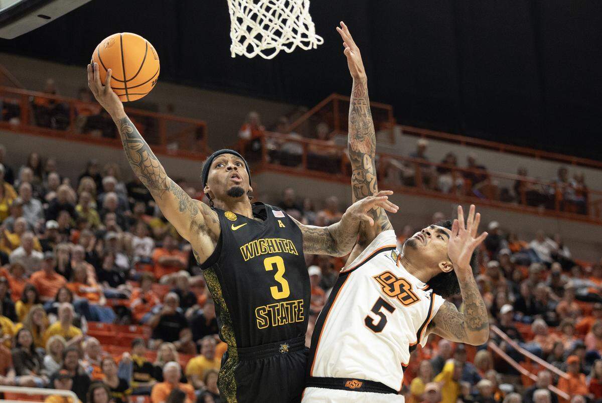 Wichita State Dre Kindell gets a shot a foul against Oklahoma State’s Vyctorius Miller during the second half of their NIT second on Sunday night in Stillwater.
