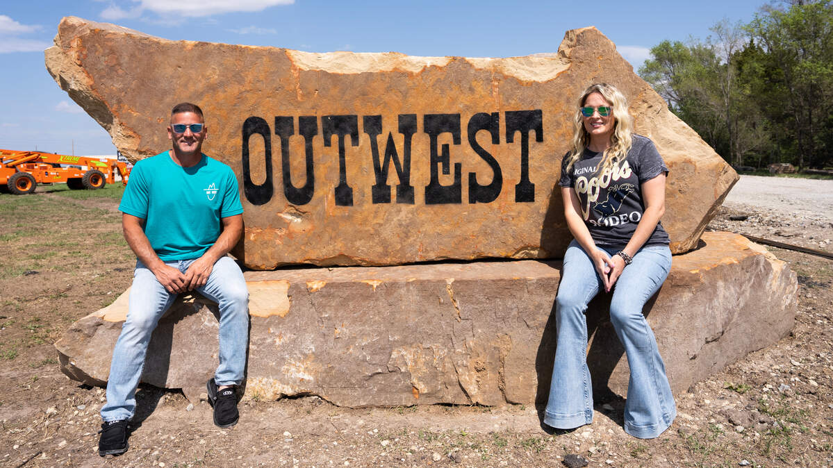 Goddard resident and developer Ben Healy is opening OutWest, a new 2,000-to-3,000-person outdoor venue on more than 9 acres at the southeast corner of Kellogg and 183rd. At right is Rachel Bowyer, who handles business development for Healy Investments and used a cutting machine to make a stencil for the large sign.