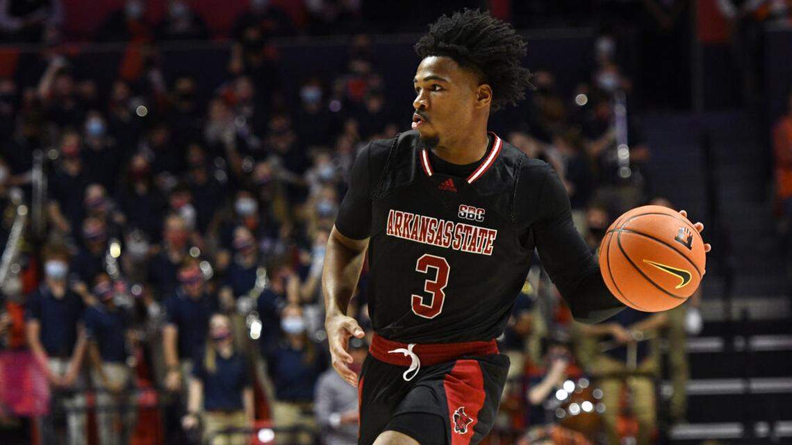 Arkansas State’s Desi Sills passes the ball during the second half of an NCAA college basketball game against Illinois Friday, Nov. 12, 2021, in Champaign, Ill. (AP Photo/Michael Allio)