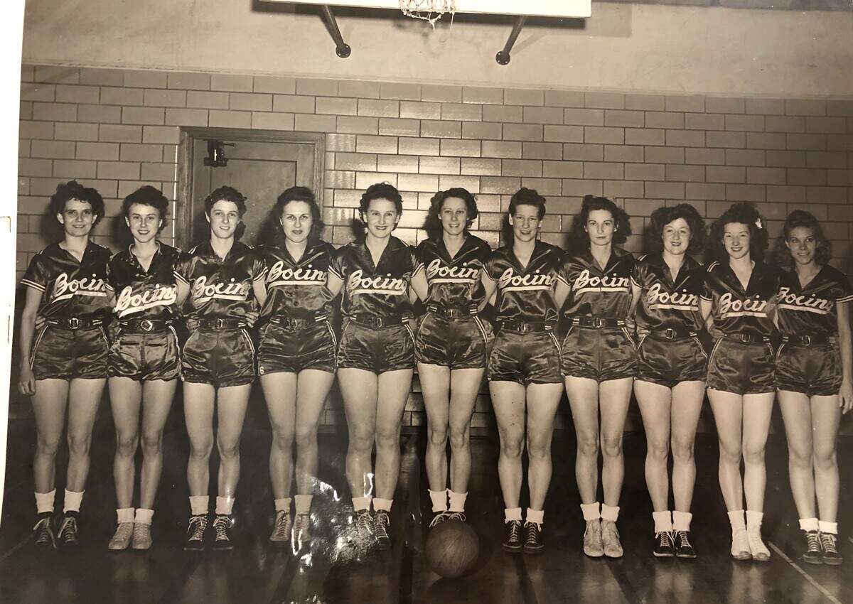 Ruth Ott, fourth from left, poses for a team photo with the Boeing Bombshells.