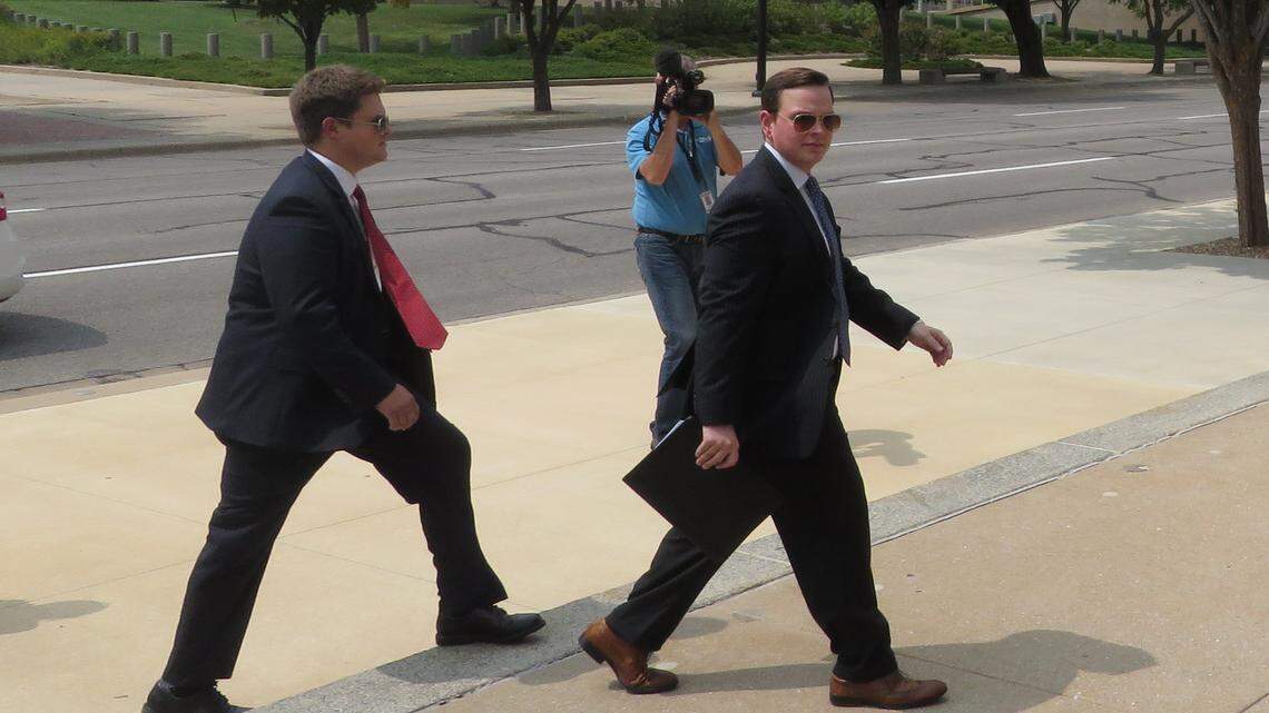 Sedgwick County Commissioner Michael O’Donnell (right) makes his way into the federal courthouse in Wichita on Friday. Photos were not allowed inside the courtroom.