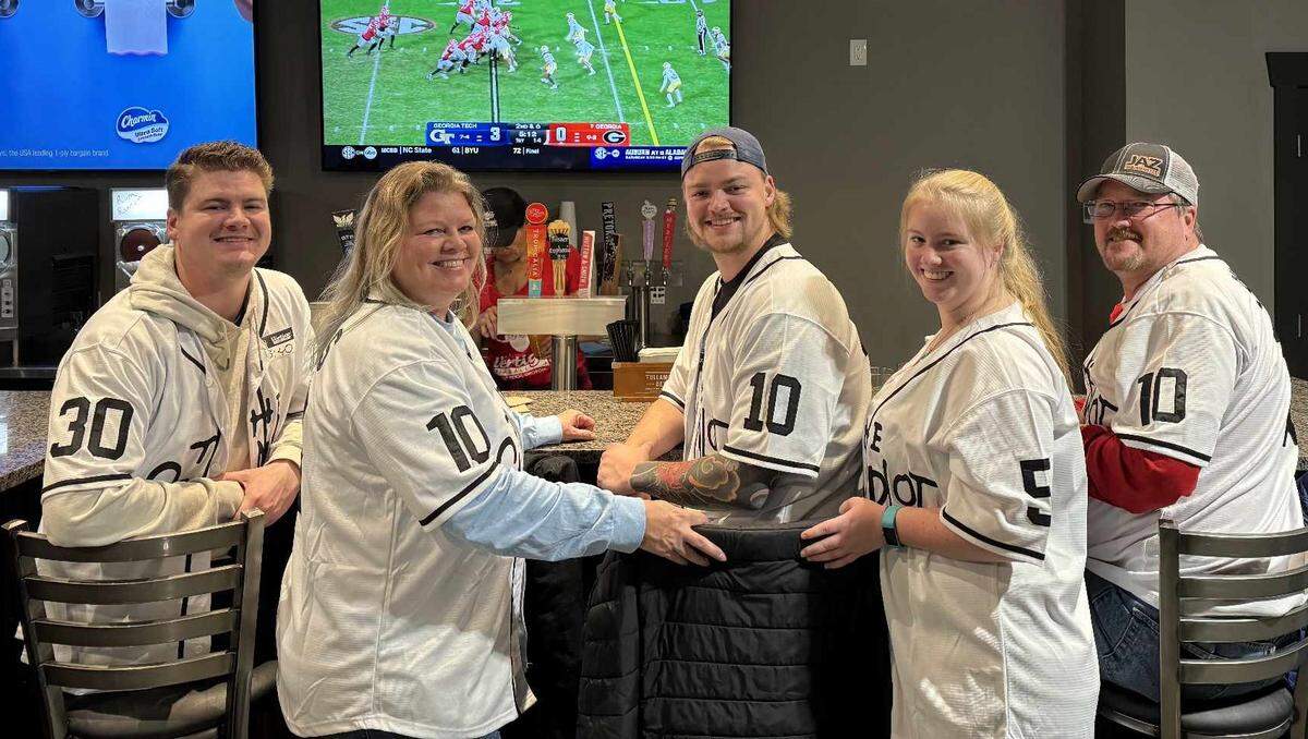 Stephanie Purcell (front left) had her children and husband dress up in jerseys representing the movie “The Sandlot.” Purcell died in a March 14 wreck in western Kansas.