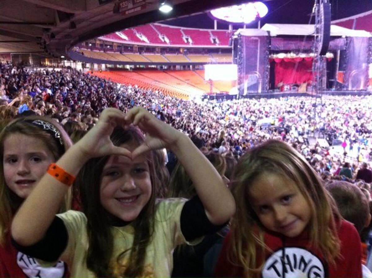 September 2011: Caroline, left, Alexis, center and Sasha were overwhelmed by the size of the crowd when we saw Taylor Swift’s “Speak Now” tour at Arrowhead Stadium in Kansas City.