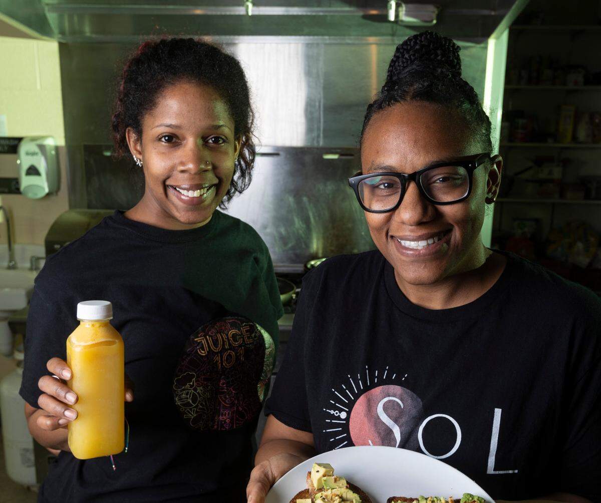 Parrishon Hardgraves, right, owner of Sol Food, and Kandy Burnett, who owns Juice 101, both focus on vegan options in their food businesses.
