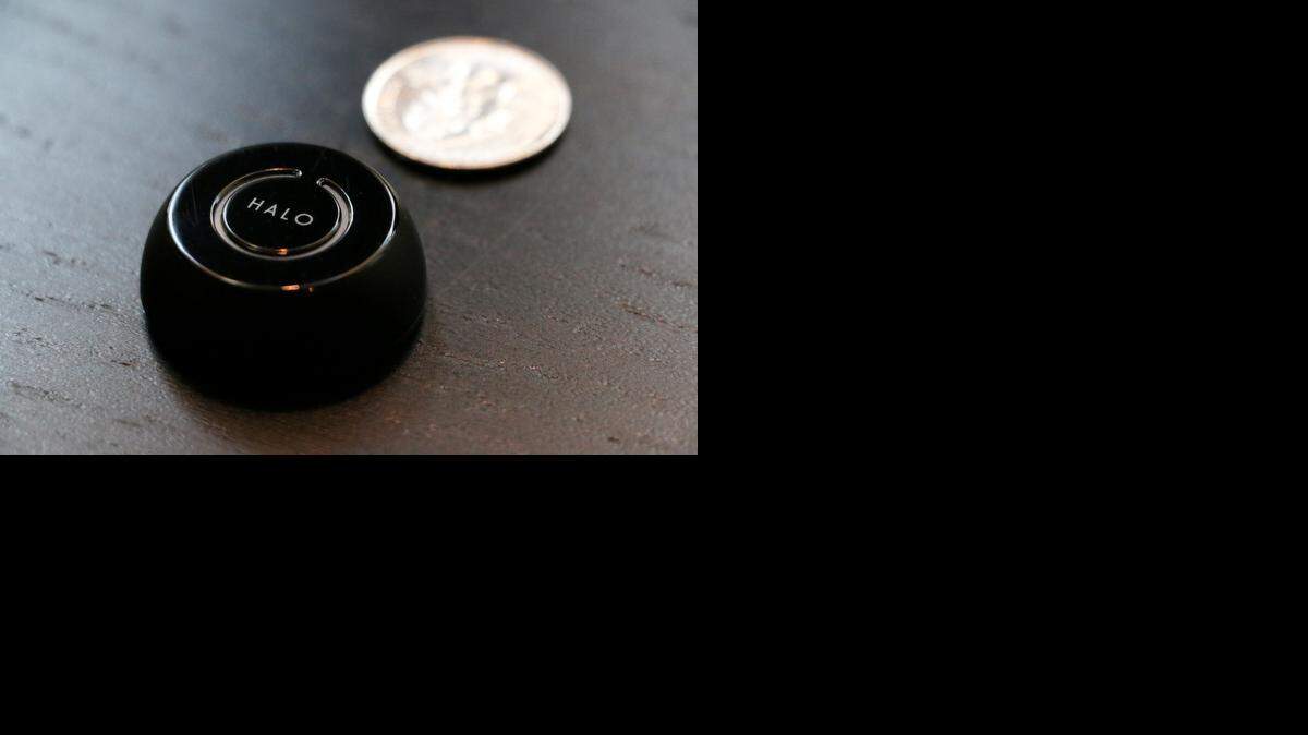 
The Halo/Hisy smartphone accessory allows the user to trigger the shutter on a smartphone camera via Bluetooth connection. 
