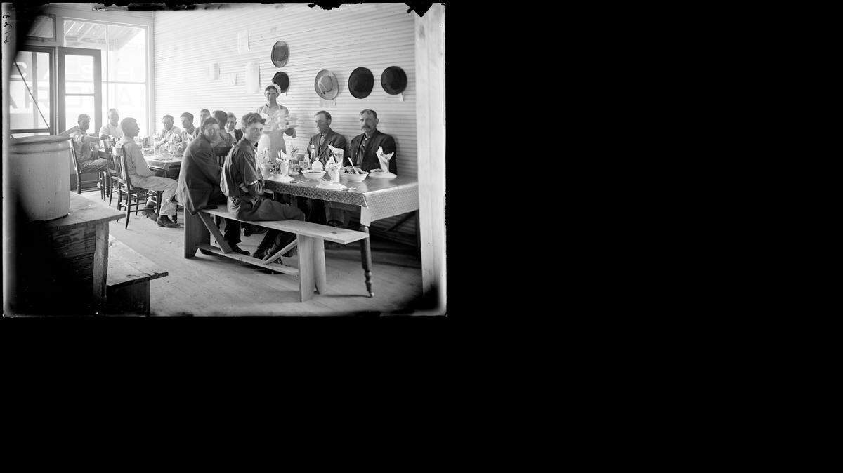 
Men eat a Thanksgiving meal at Sheetz Restaurant in Russell in 1911.
