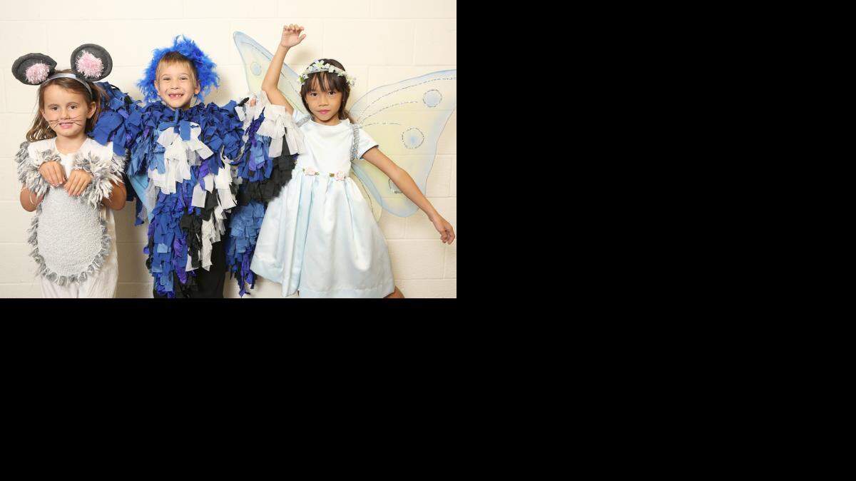 
Tessa Demski is dressed as a mouse, Ethan Crow as a bird and Betsy Kohn is a fairy. The three are involved in Christian Youth Theater Wichita. (Aug. 12, 2014) 

