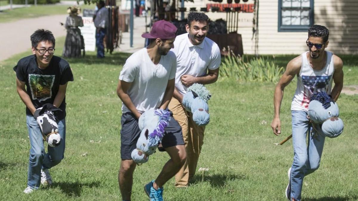 Visitors compete in a stick pony race at Cowtown on Saturday in 2016. Cowtown is offering sessions on 1870s games and pastimes this summer.