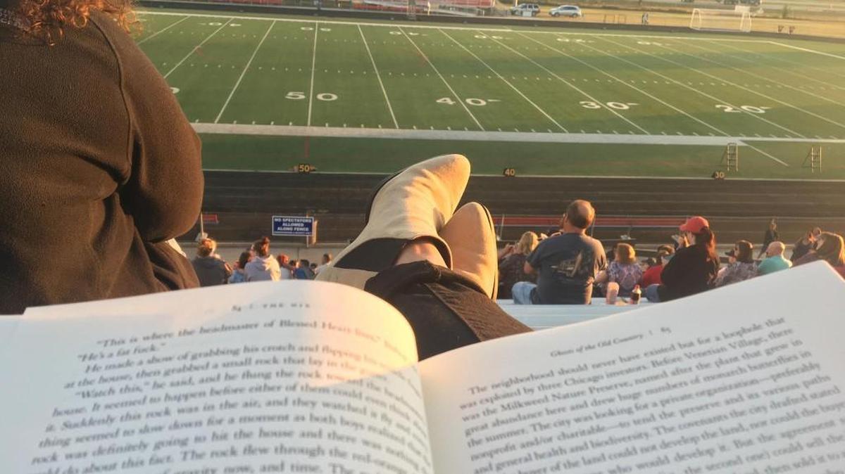 While awaiting my son’s band performance recently, I enjoyed several chapters of a new novel al fresco, overlooking South High’s stadium on a gorgeous fall evening.