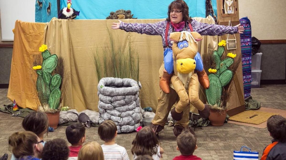 Janine Eilert with the Goddard Puppet Ladies performs in "The Horned Toad Prince" show at the Evergreen Branch library in 2016. The library is offering more free puppet shows this summer.