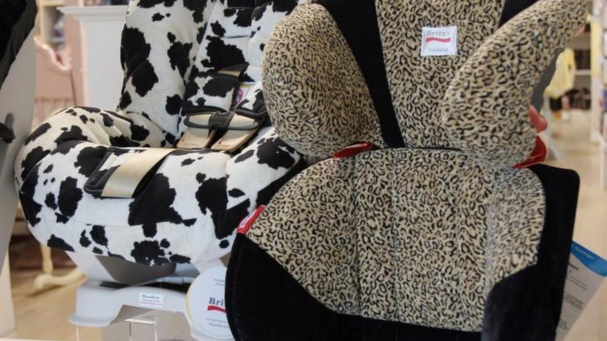 A booster seat at right with side impact protection in the head support is for sale at Marshmellow Kisses in Tallgrass in this 2006 file photo. In 2006, Kansas expanded its laws regarding booster seats.