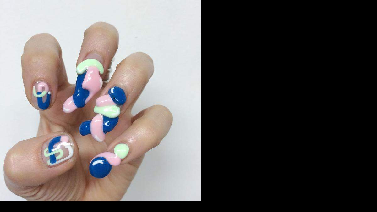 
Right now, it’s all about nails. Rhinestones, 3-D designs (pictured), textured topcoats and new offerings from fashion royalty have upped the ante on fingertips. 
