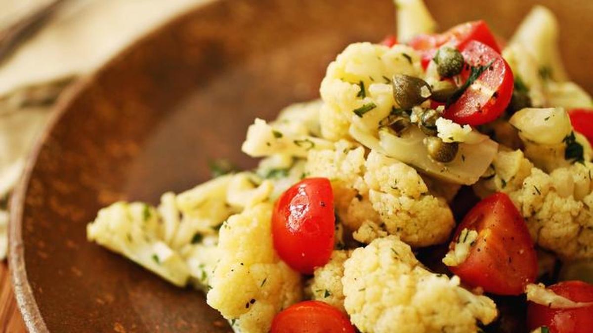 Pan-Seared Cauliflower with Capers uses cauliflower that is first steamed in a skillet then pan-seared for flavor.