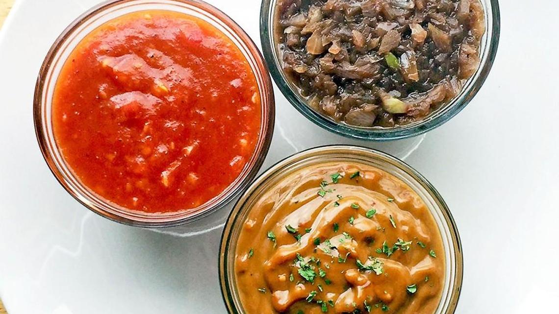Clockwise from left: Spicy mango barbecue sauce, red wine sauce and peanut sauce.