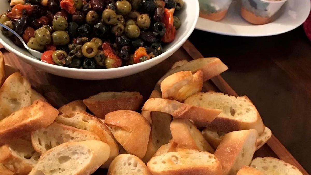 You won’t be able to stop eating this roasted olive medley, served with bruschetta toasts.