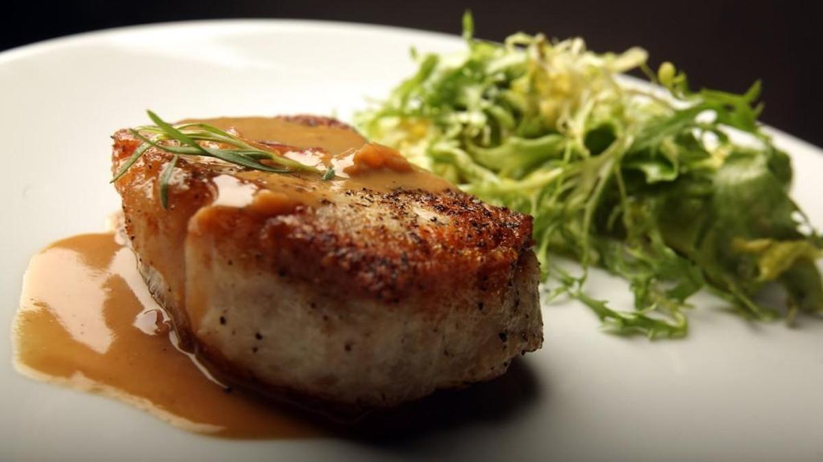 Having a pan sauce is a good way to spruce up any meal, especially this pork chop with mustard tarragon sauce.