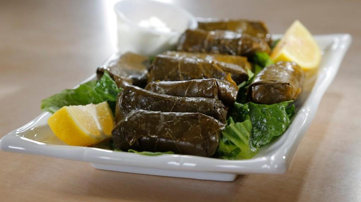 Making stuffed grape leaves is a social as well as a culinary event.