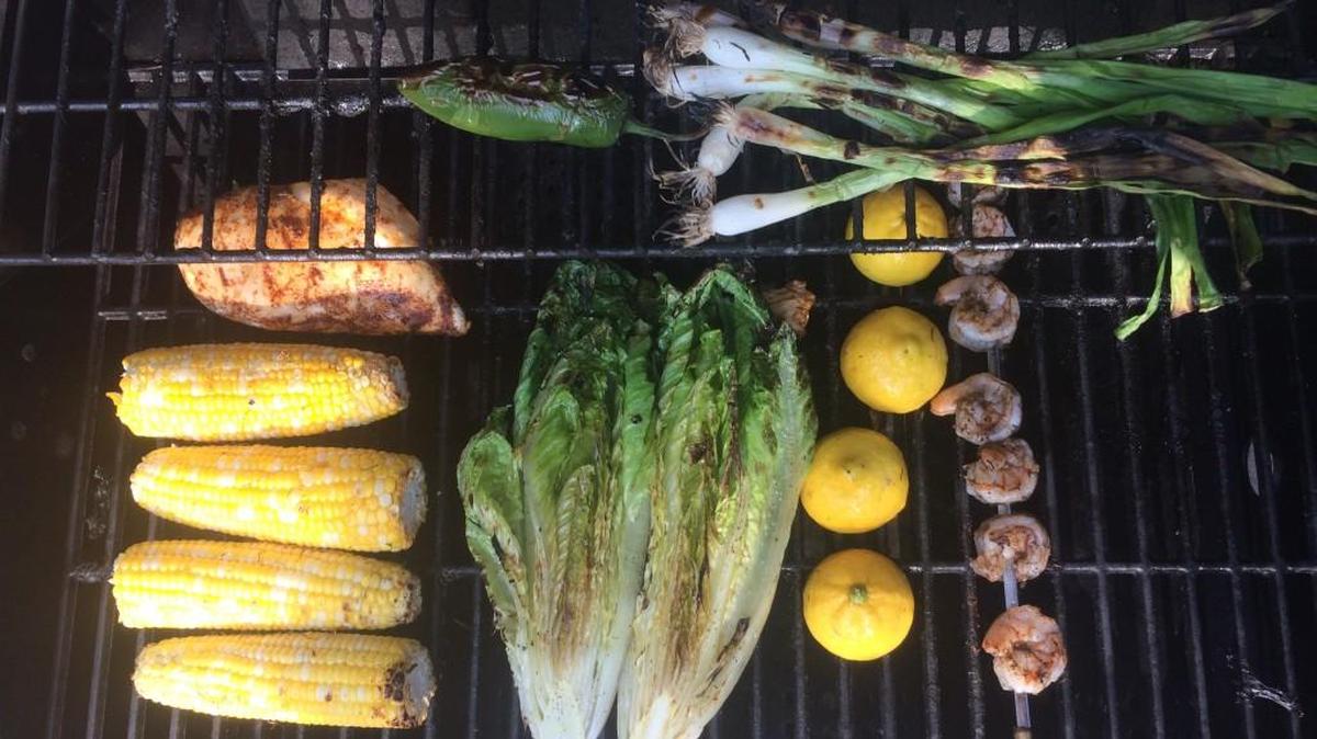 Romaine is the lettuce of choice for grilling because of its structure. Add a half a grilled lemon to squeeze over the Romaine.