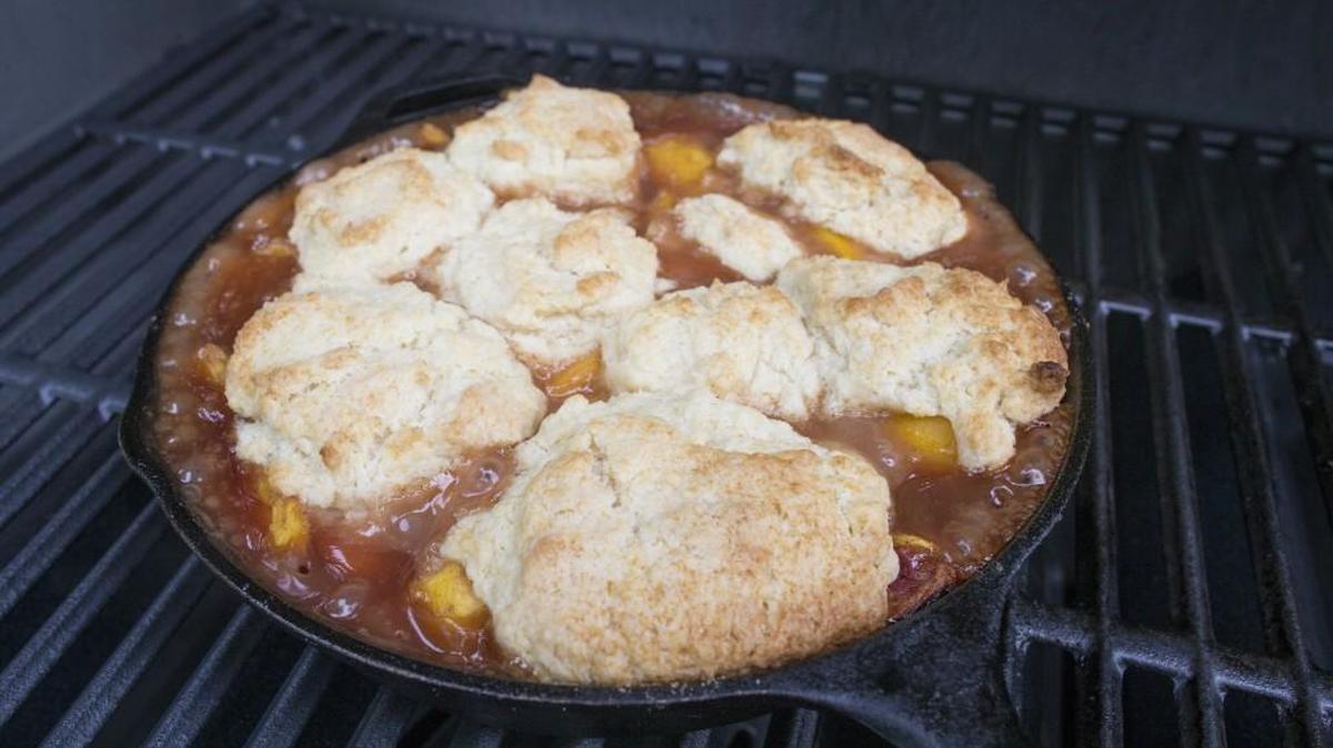 With a good grill, you can get a nice brown top on your peach cobbler biscuits.