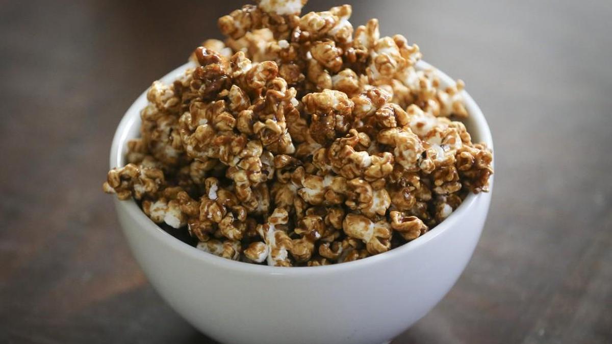 Pumpkin spice popcorn is like caramel corn with a hint of pumpkin pie seasoning.