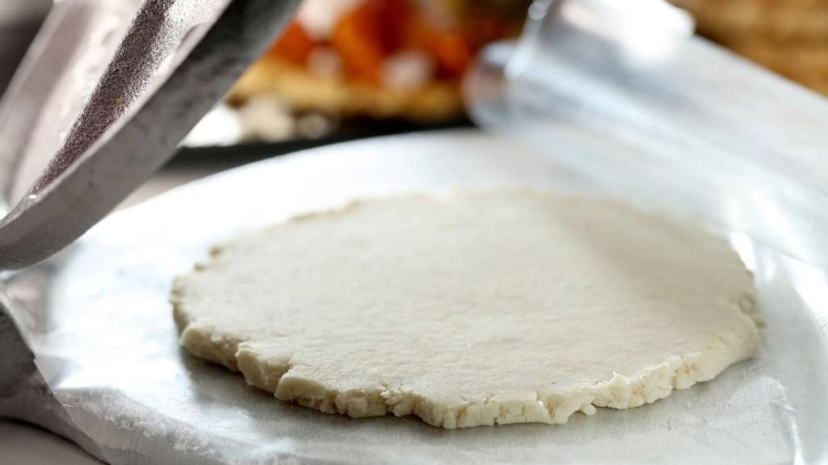 Gorditas are masa dough disks, a good deal thicker than a tortilla. You can flatten them in a tortilla press.