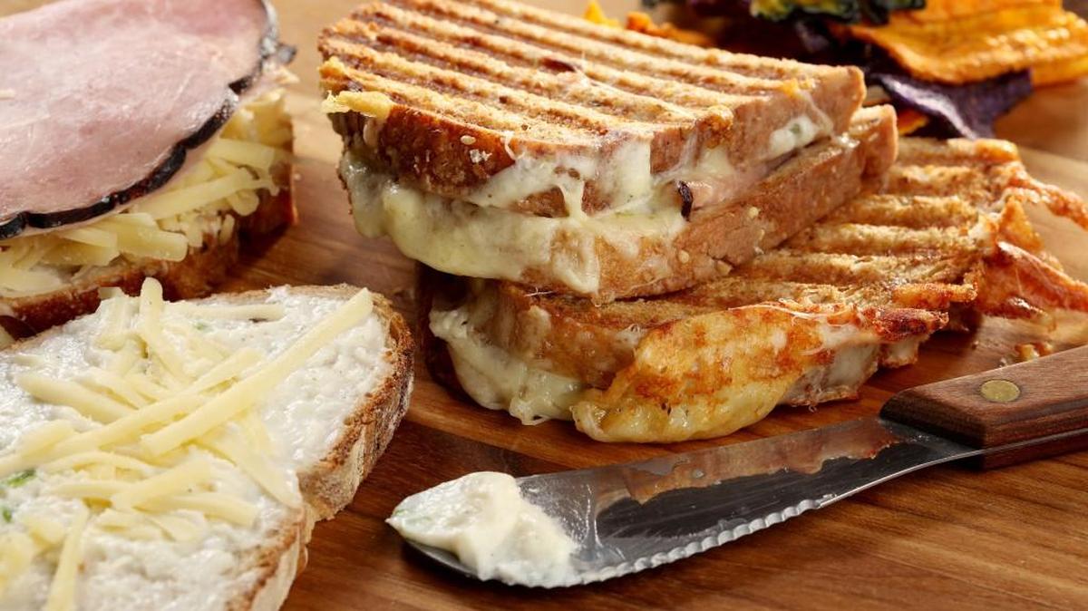 A cheese sacue enriched with cream cheese and plenty of herbs boosts a croque-monsieur.