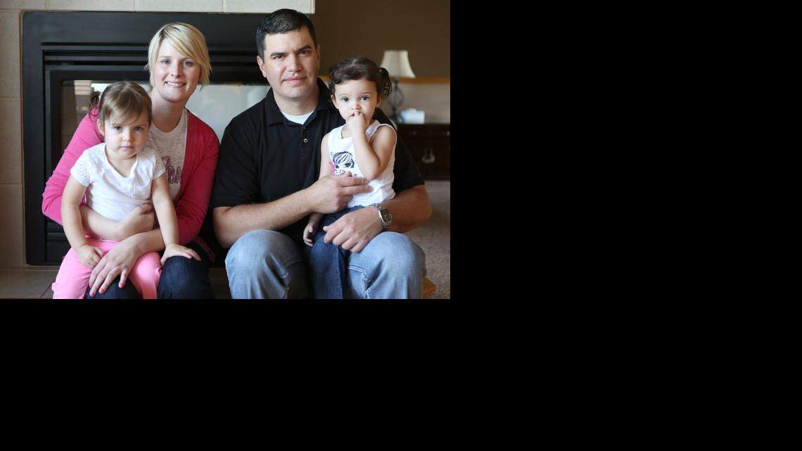 
Sara Gonzales and her husband, Gary Gonzales, hold their twins Bella, left, and Emma. Nine months after giving birth to the twins, Sara was diagnosed with cancer. Coming from a line of women who had breast cancer and having tested positive for the BRCA gene mutation, she knew it was a matter of time before she would get cancer. 
