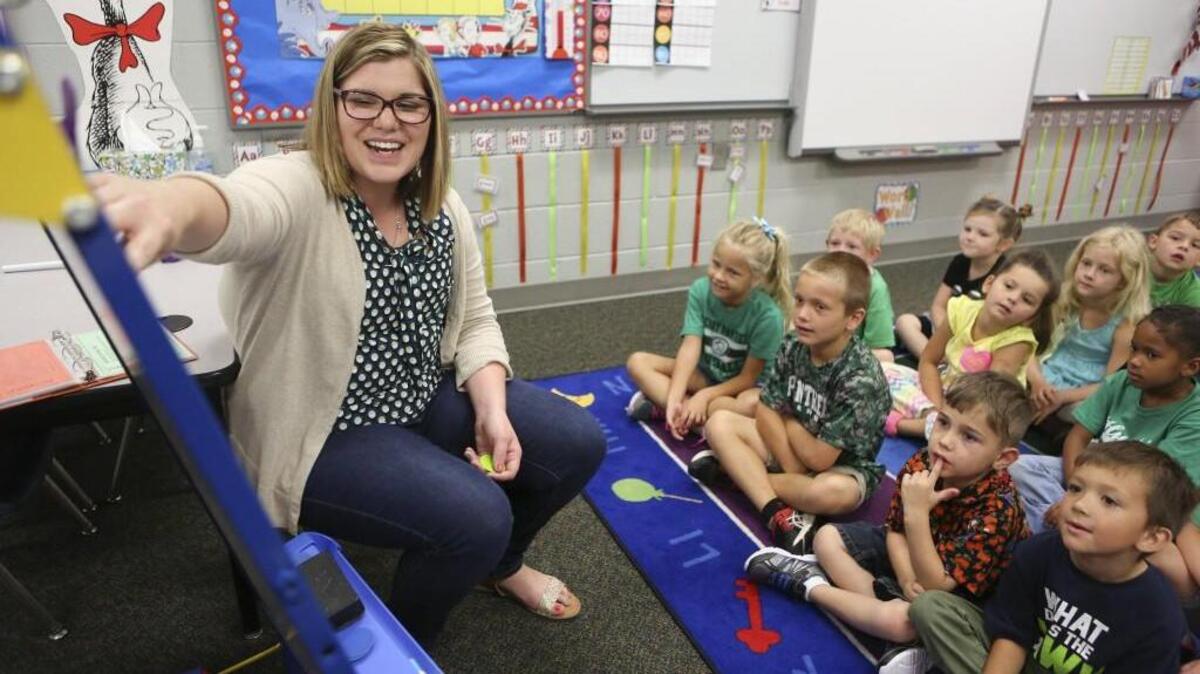 Christine Funke, a kindergarten teacher at Park Hill Elementary School, works on a reading lesson with her class. Funke tested positive for the BRCA1 breast cancer gene. (Sept. 17, 2016)