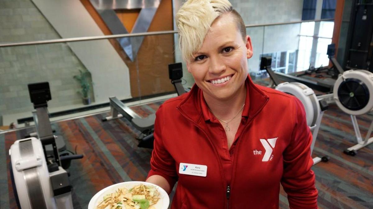 Kera Harrod splits her time between the YMCAs in El Dorado and Andover, leading individual and group fitness sessions. She’s holding fish tacos she made.
