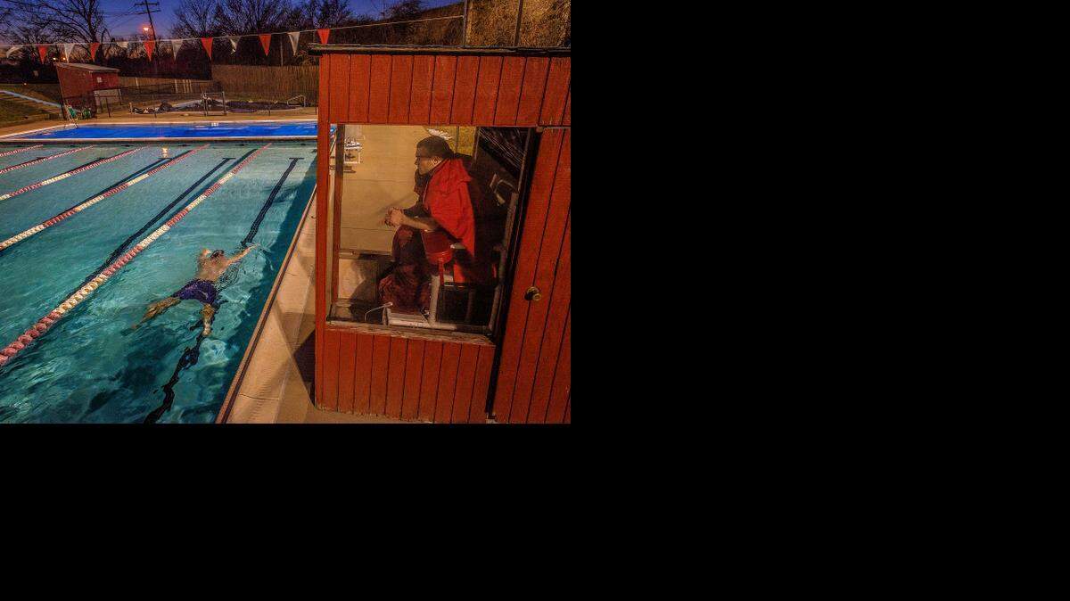 
All lanes are open: a lifeguard stays warm in a little shelter at the edge of the Silver Spring, Md., YMCA’s outdoor swimming pool. Exercise in winter. 
