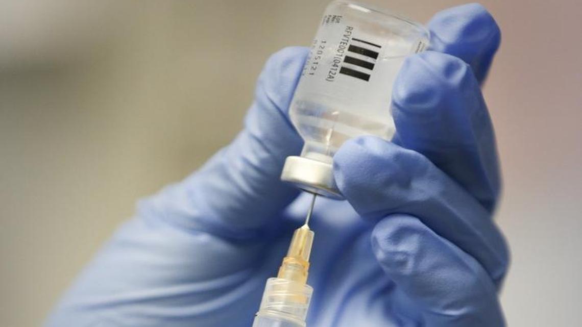 A flu shot is prepared at a local clinic.