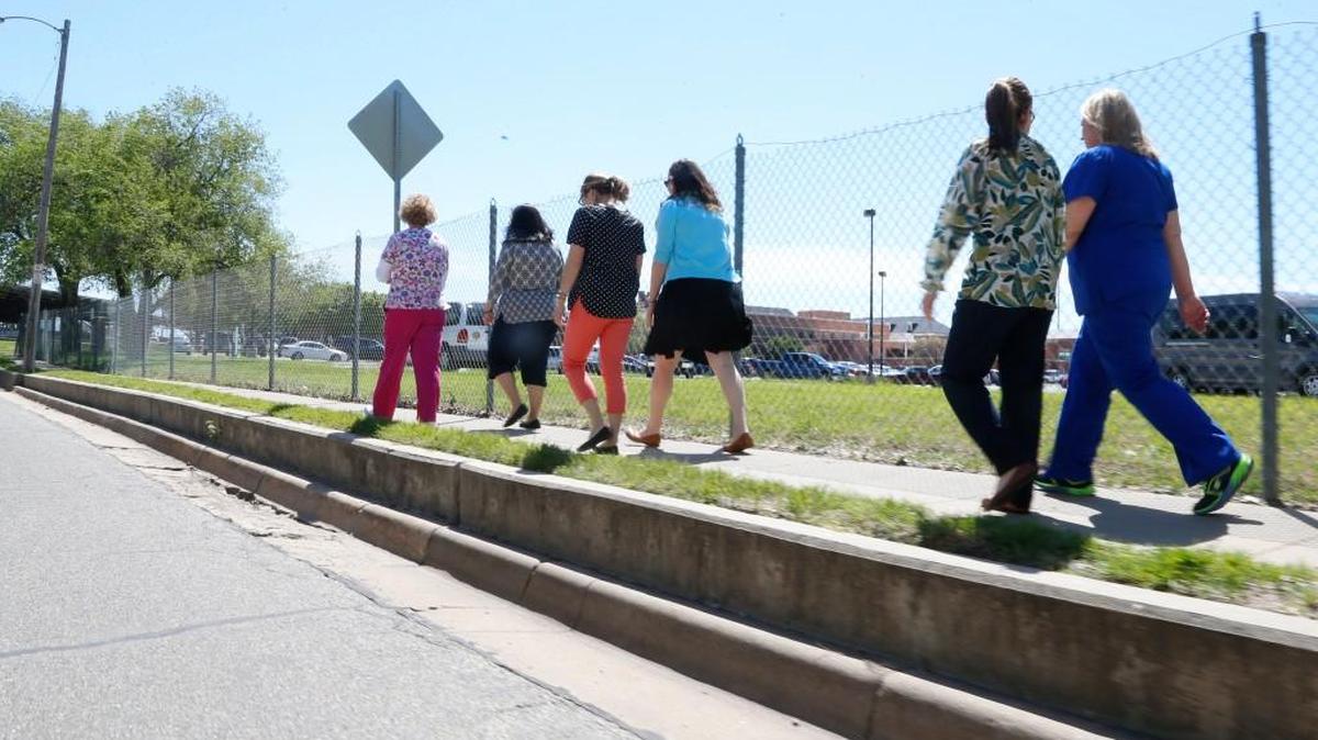 A number of employees at the VA hospital get together to walk every day at noon. (April 24, 2017)