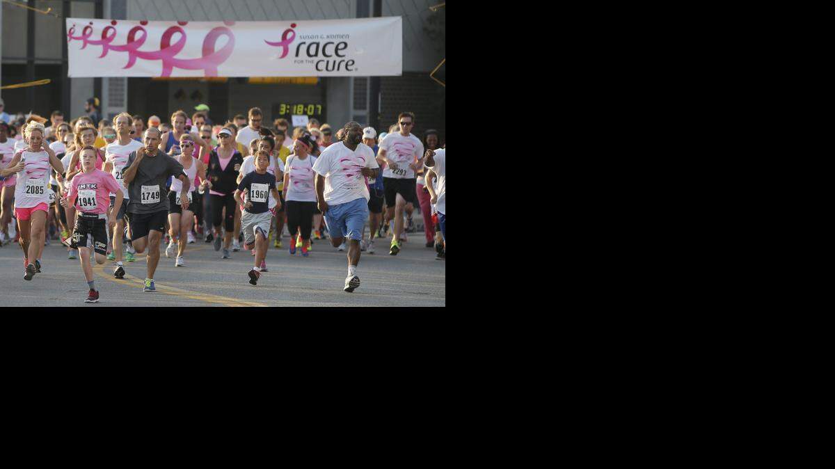 
Runners sprint from the starting line during the Komen Race for the Cure 5K in downtown Wichita. Running a race isn’t as simple as just putting on shoes. You have to get the right equipment and train correctly. 
