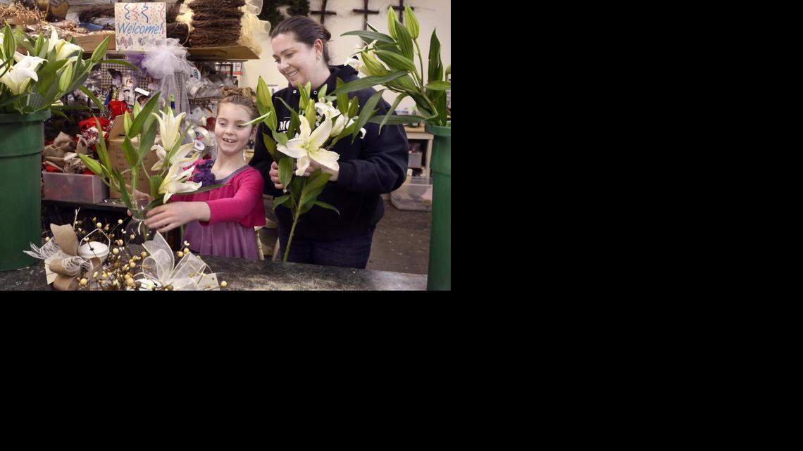 
Bella Carroto, 9, helps her mother, Loren Carroto, create a flower arrangement at the family business, Monessen Florist. Bella has pediatric kidney stones. 
