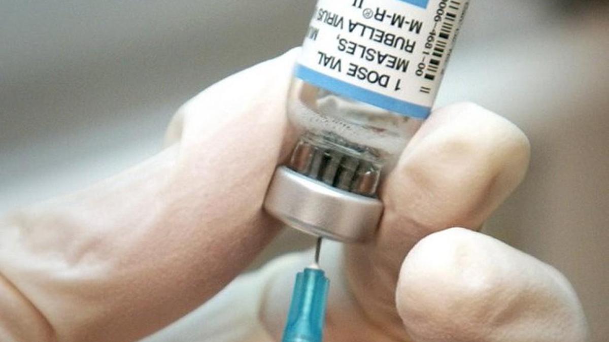 A nurse draws a dose of mumps-measles-rubella, or MMR, vaccine in this file photo from 2006.
