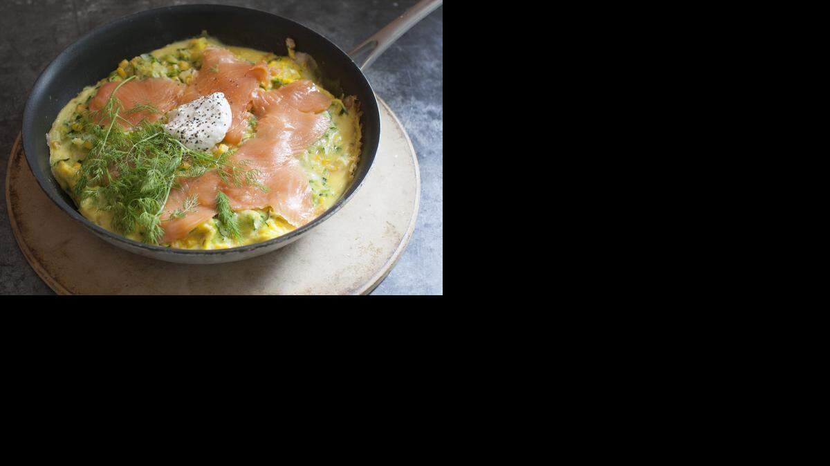 
An open faced corn and zucchini omelet with smoked salmon 
