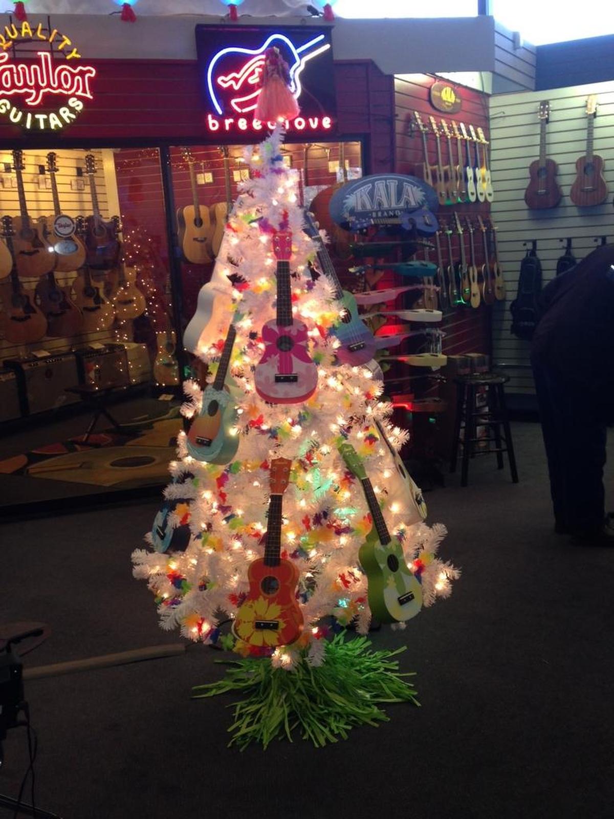 Senseney Music’s decorations include a ukelele tree, which is hula-skirted and topped with a hula dancer.