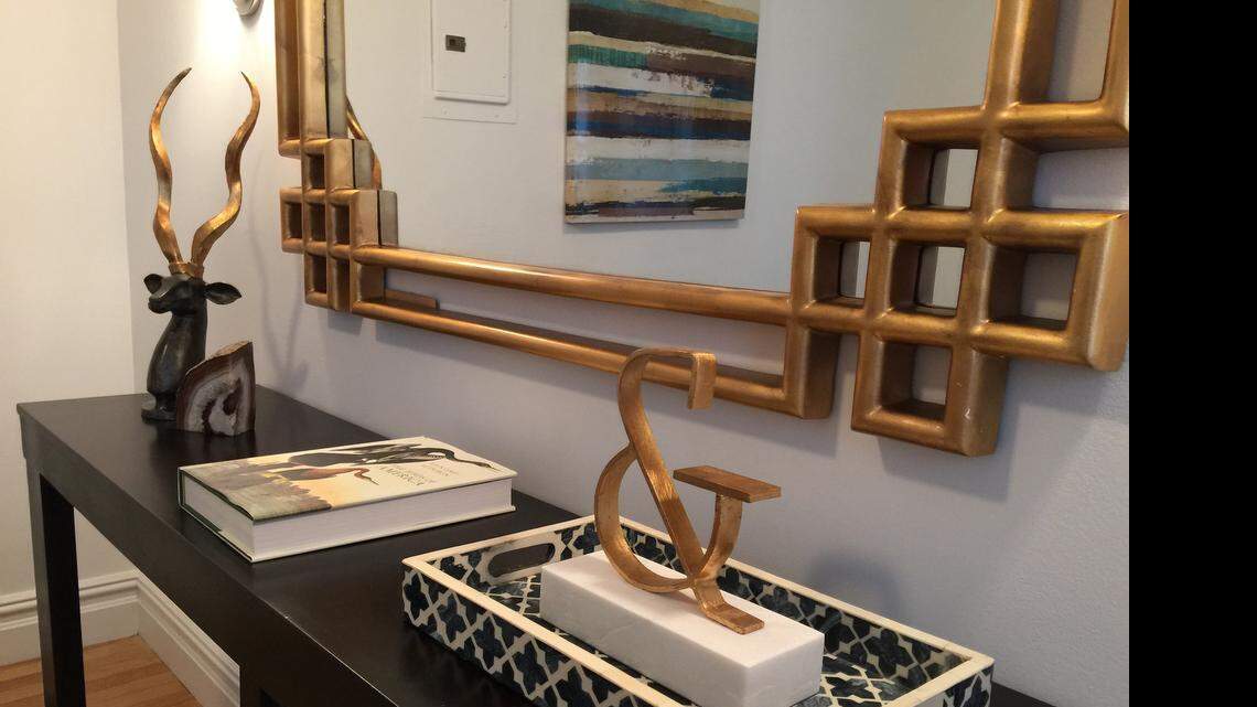 
A chevron graphic-inspired tray provides a sense of elegance in this dining room. 
