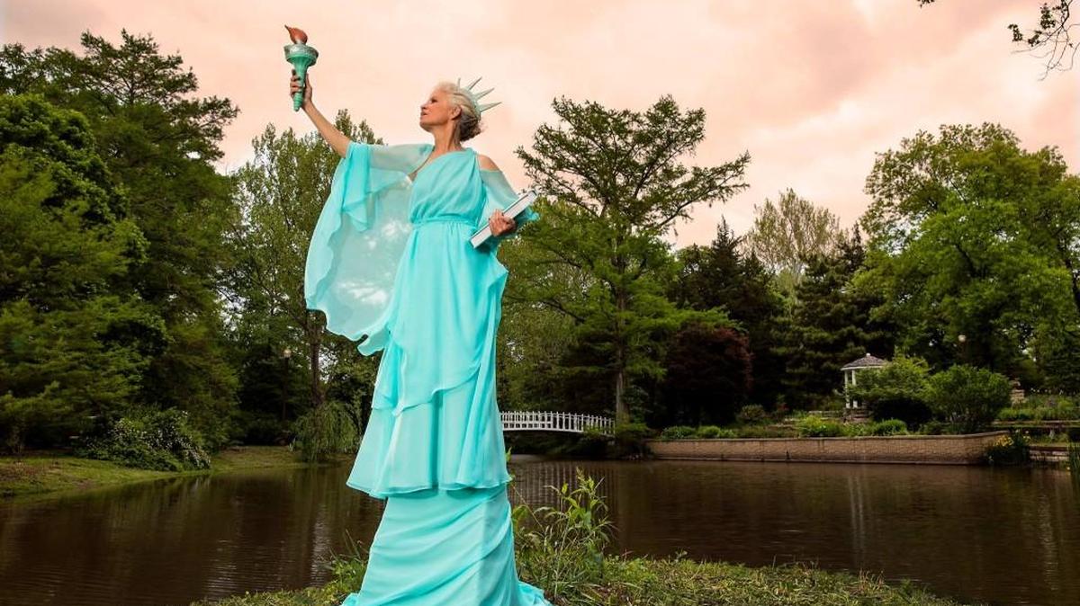 Robin Macy as the Statue of Liberty, at Bartlett Arboretum.
