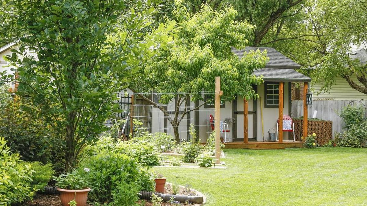 The garden cottage with its own front porch is seen beyond the vegetable garden in David and Gwynne Bonifield's yard.