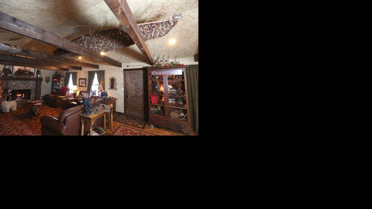 
A 15-foot canoe is tucked into the rafters at Bear Lodge. Doris Horning covered it with about 5,000 acorns and other natural elements.
