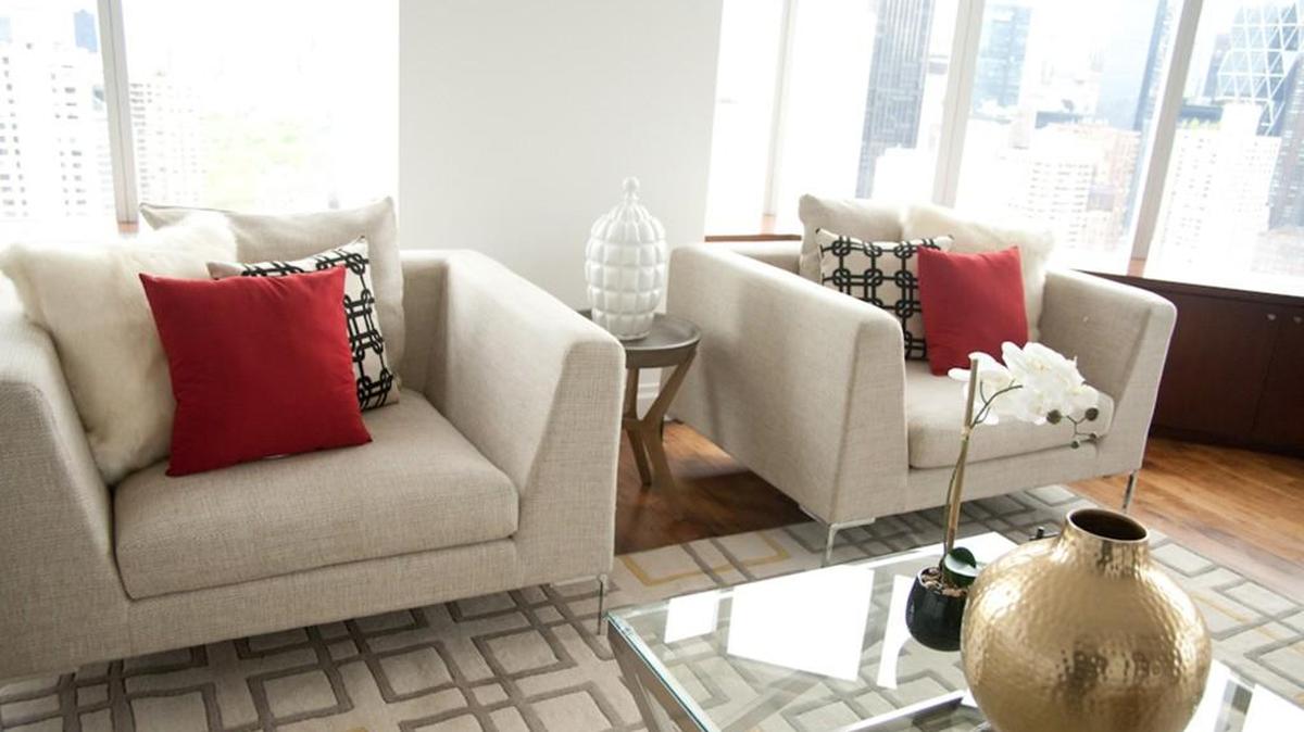 A pop of red adds vibrant color to two side chairs.