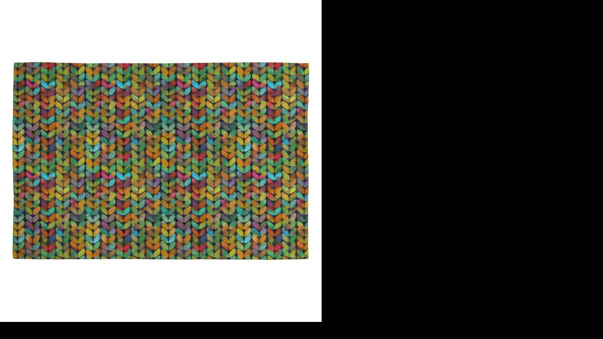
The Deny Designs Betsy Olmsted Acid Knit rug is printed with a vibrant and unexpected knitted motif (wayfair.com).
